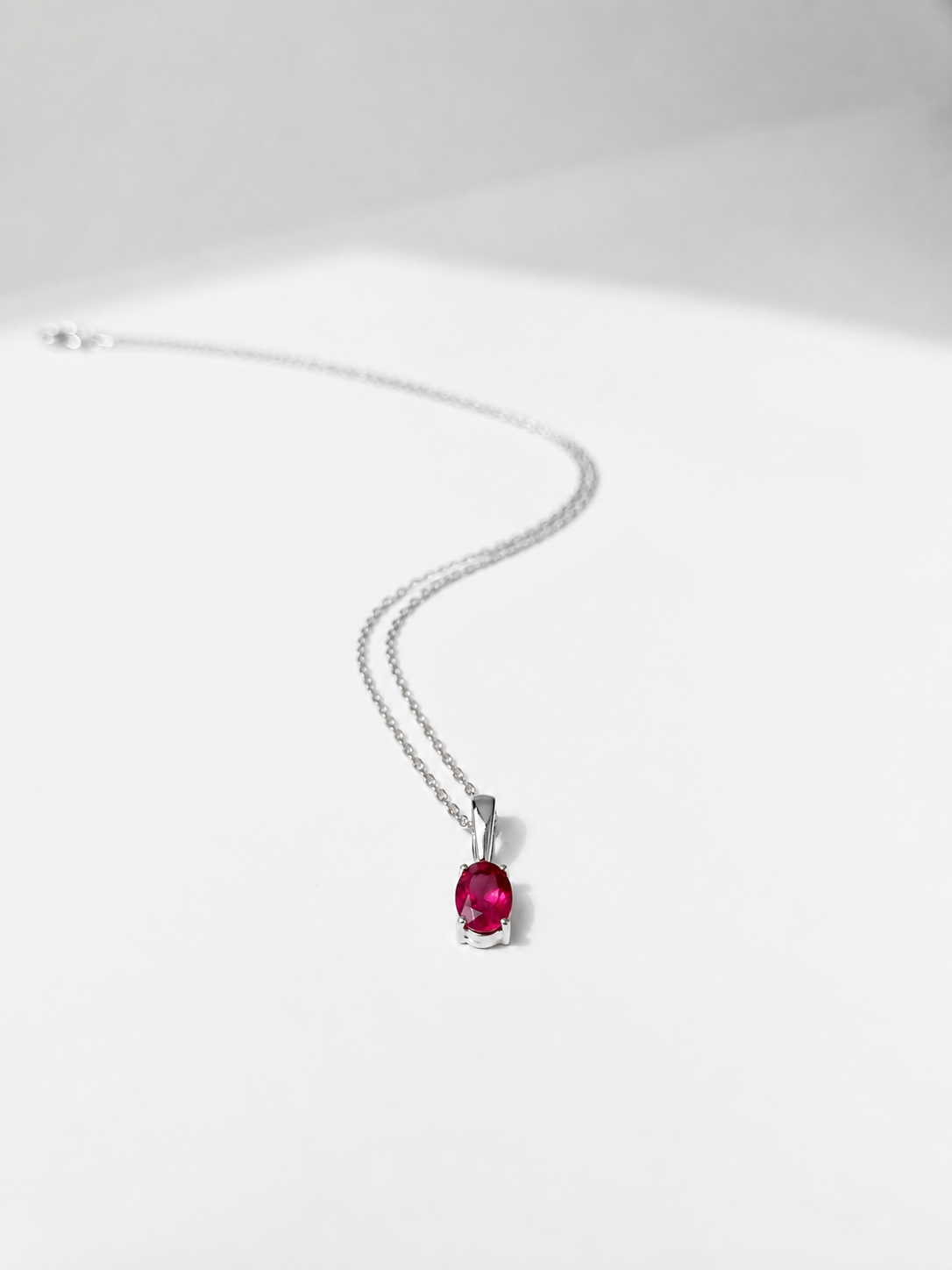 COLLAR OVAL RUBI 6X4MM PLATA